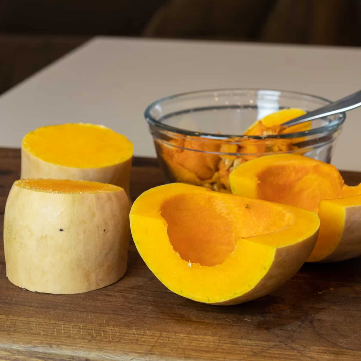 A butternut squash cut into portions.