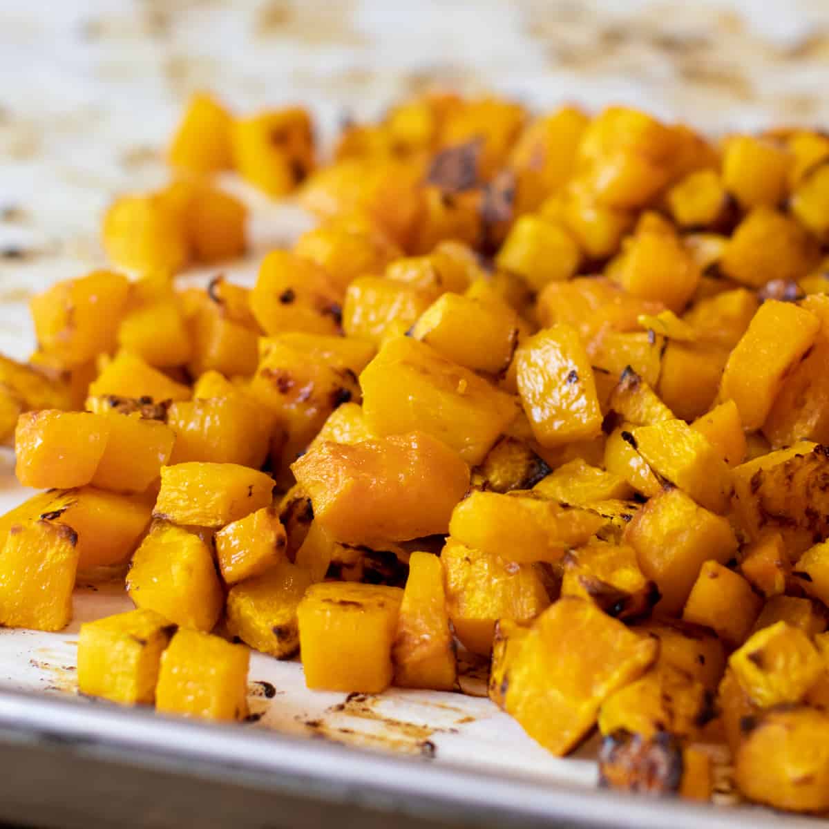 A pile of cubes of cooked squash.