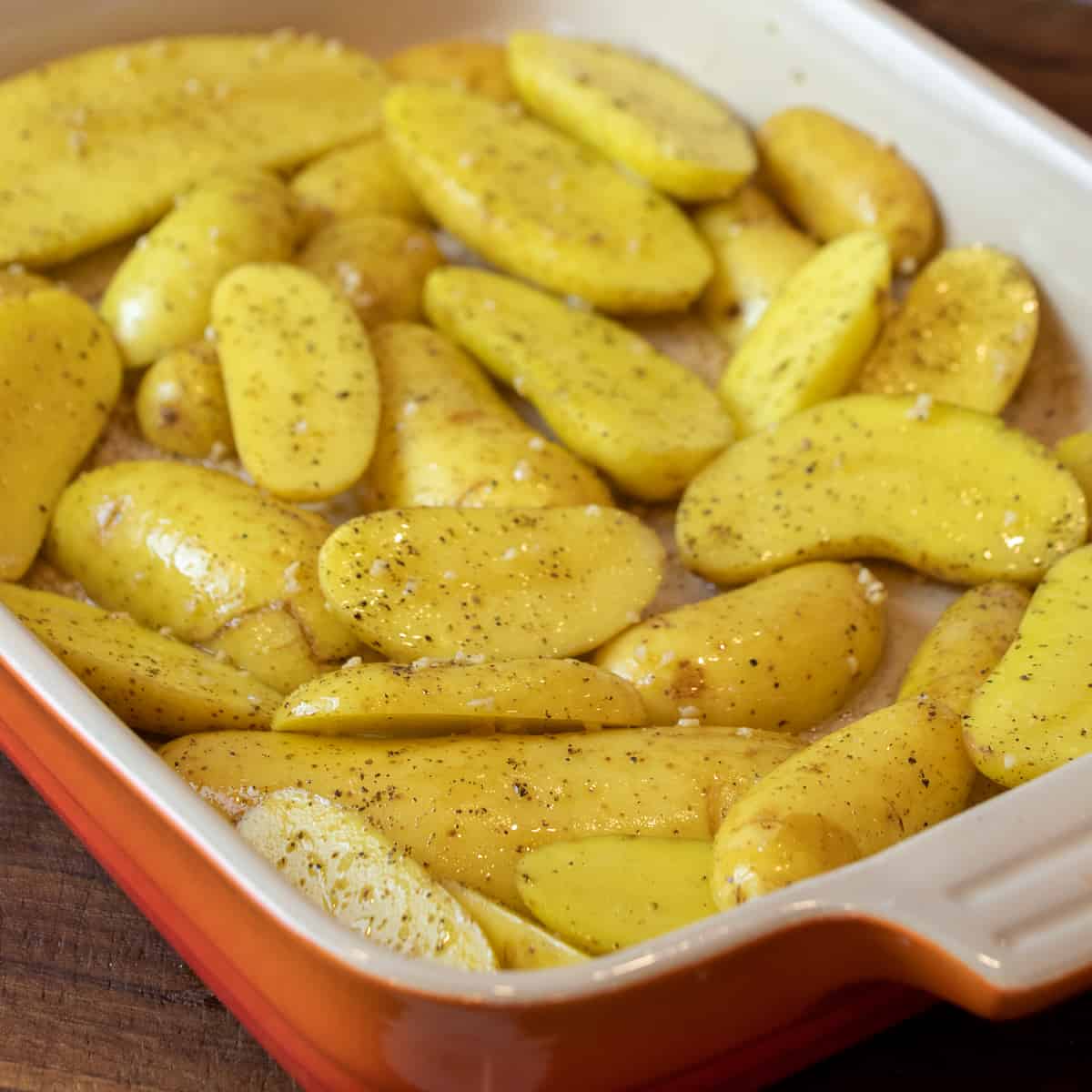 Raw potatoes tossed in oil and seasonings.