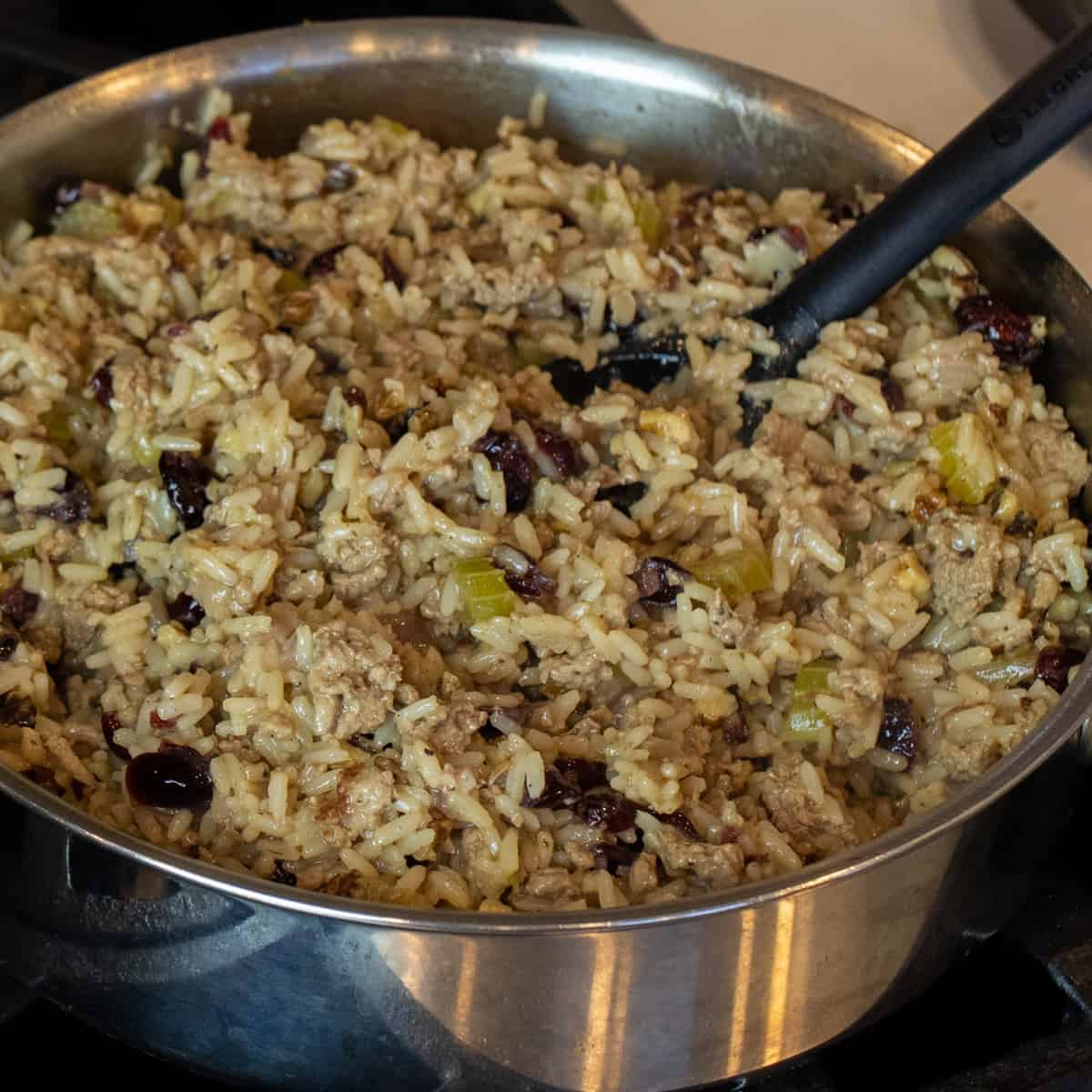 Turkey and rice stuffing prepared and in a frying pan.