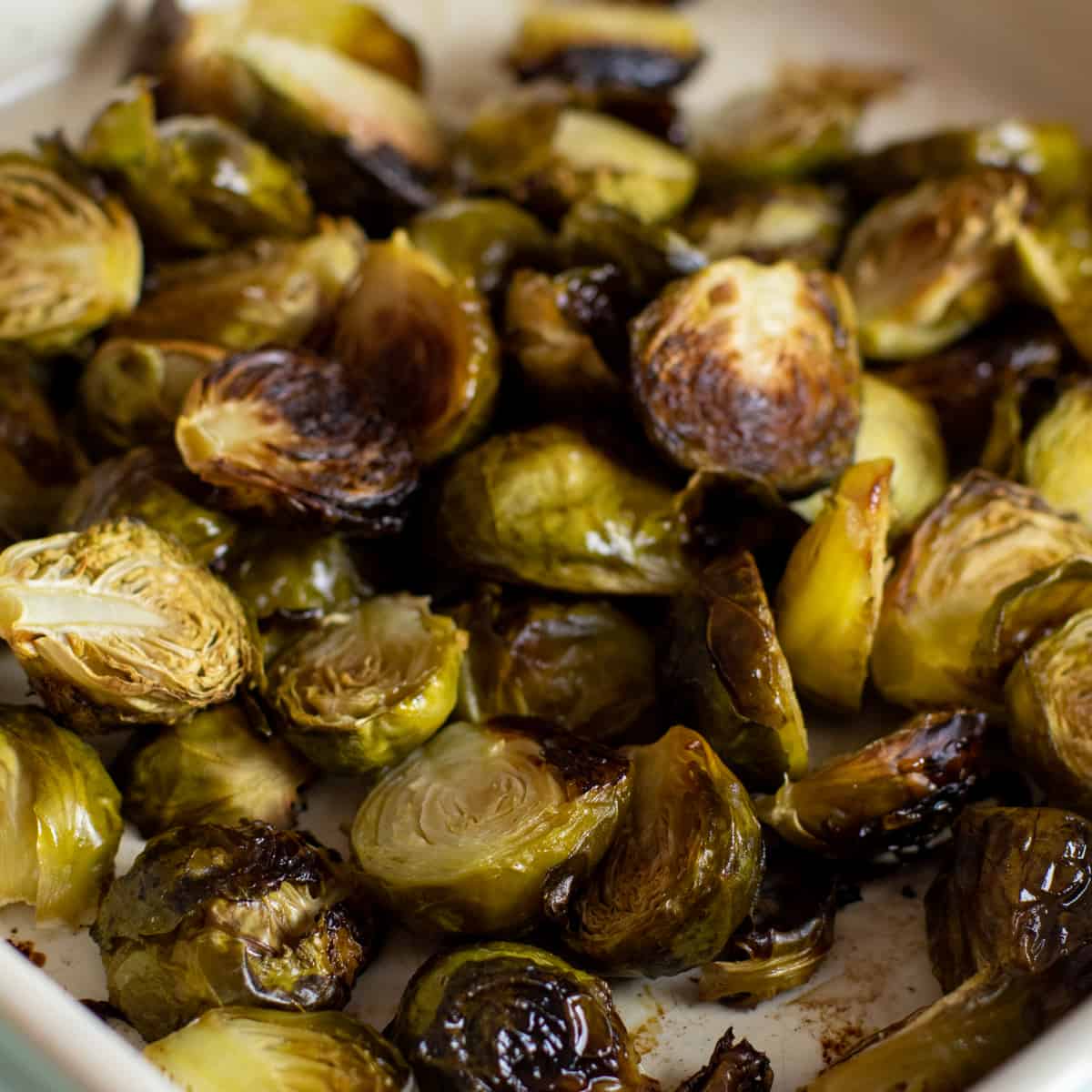 A baking dish with roasted Brussels sprouts.