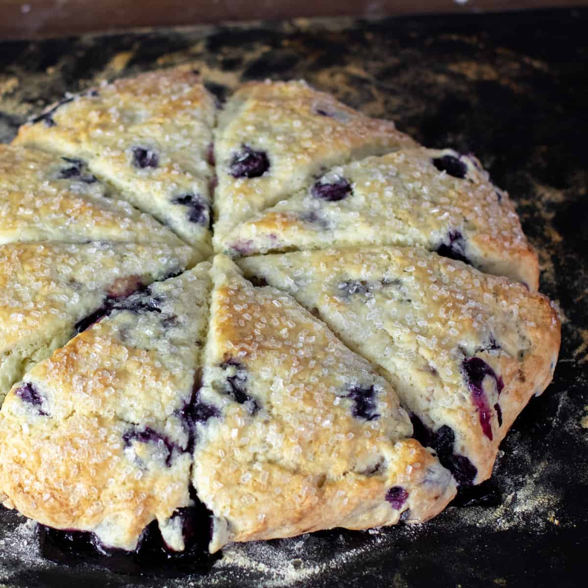 Baked scone wedges on a baking stone.