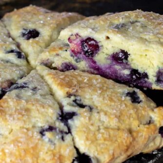 A slice of a scone being lifted off the baking stone.