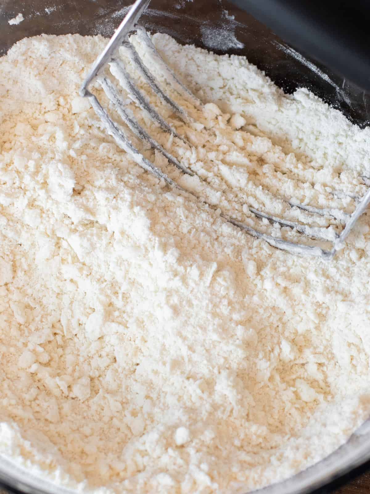 Lard cut into the flour with a pastry cutter.