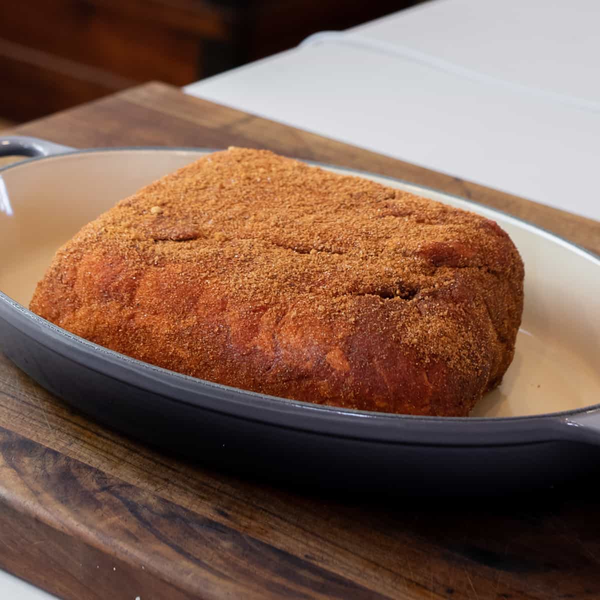 Pork roast covered with a seasoning rub.