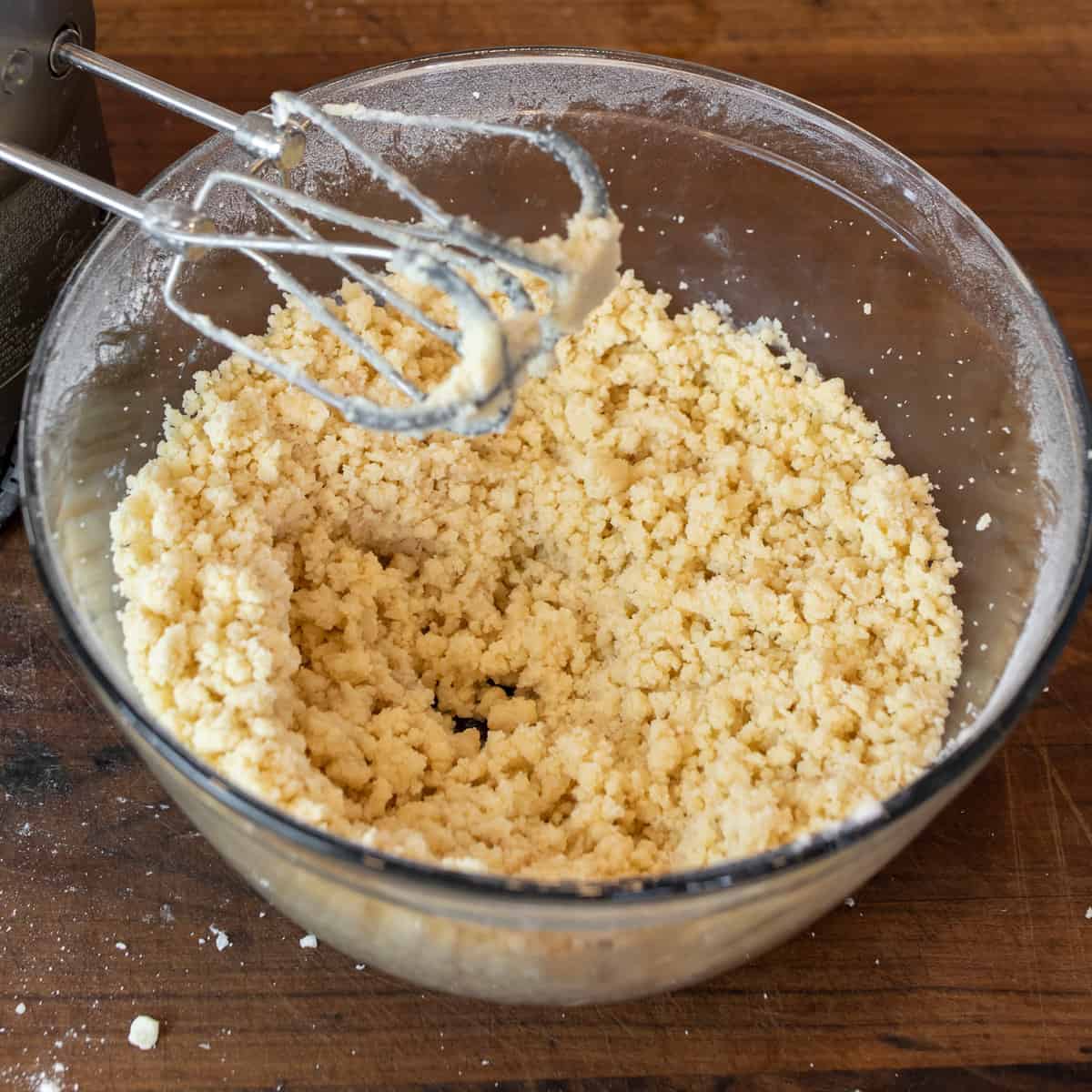 A glass bowl with raw cookie dough.