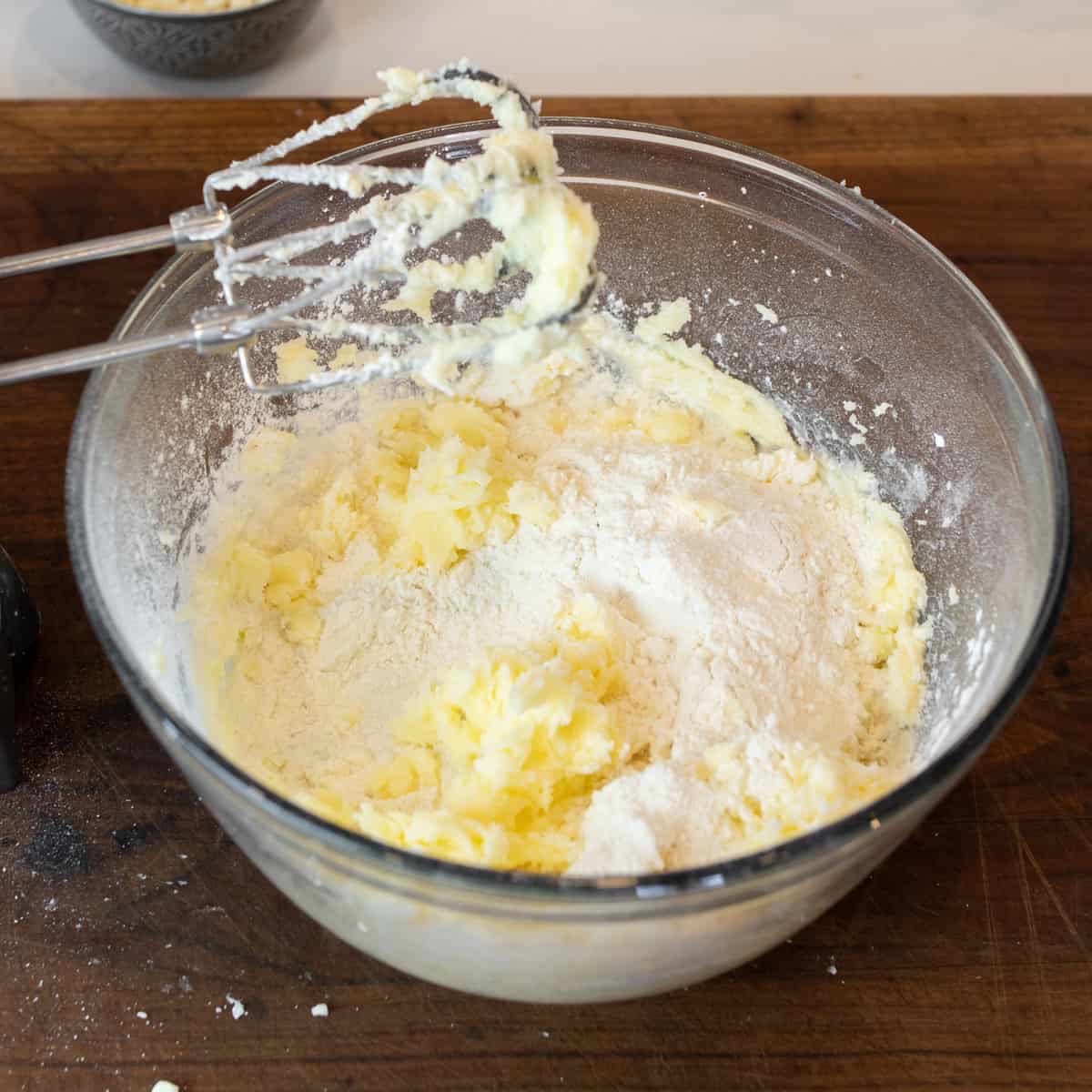 Flour, butter and sugar in a mixing bowl.