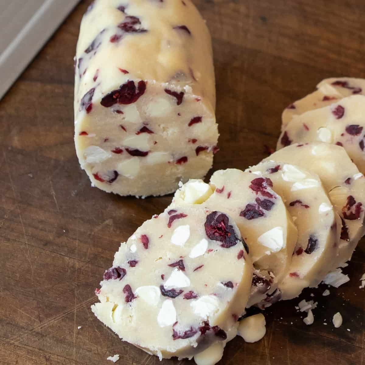 Cookie dough log cut into half inch slice cookies.