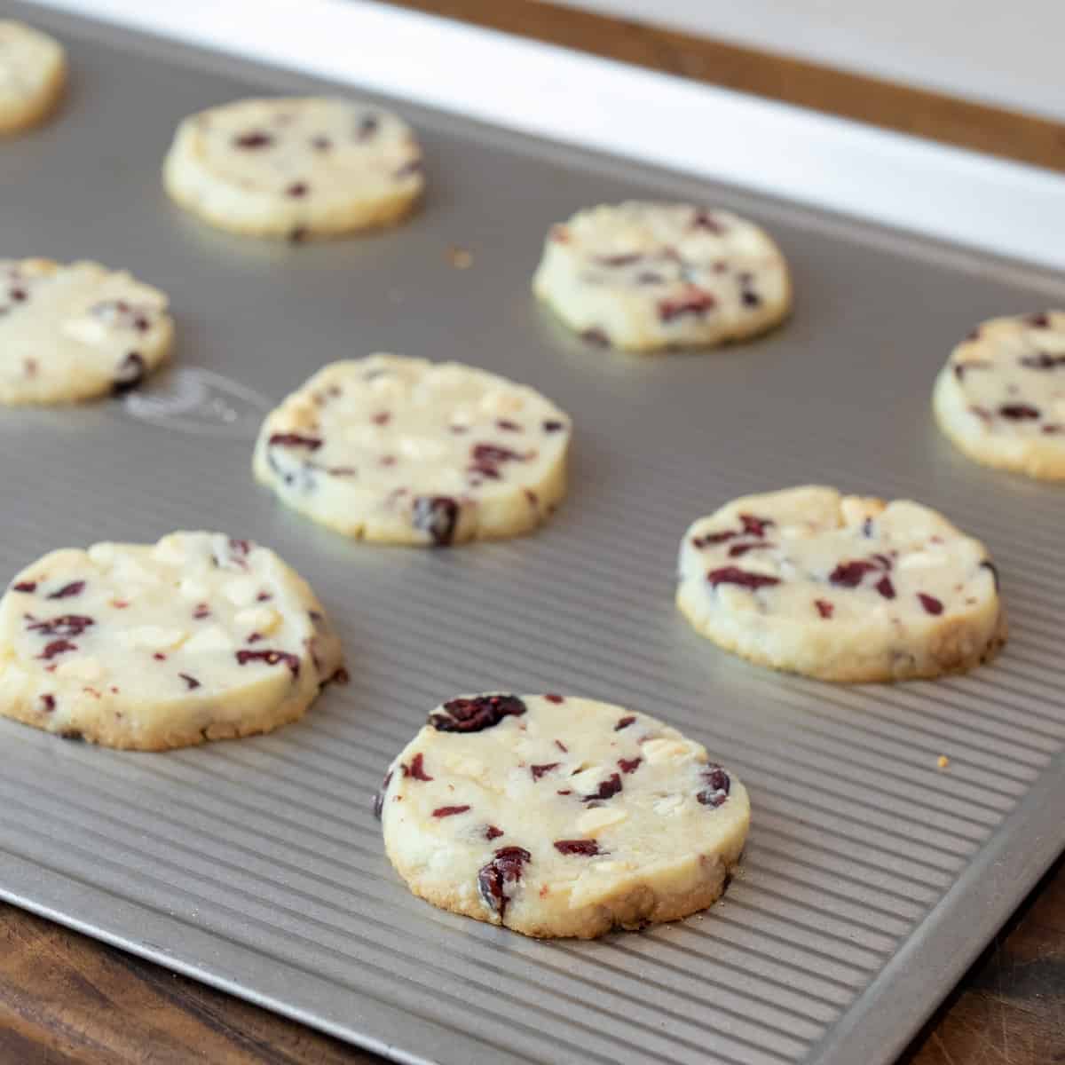 Fresh baked cookies on a baking sheet.