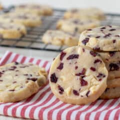 A stack of cookies on a napkin.