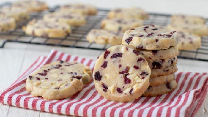 A stack of cookies on a napkin.