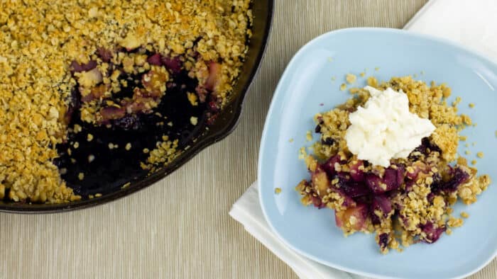 A plate with dessert crumble serving.