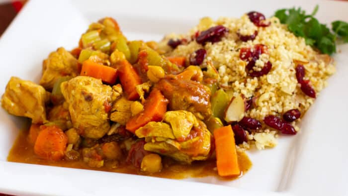A plate of stewed chicken and couscous