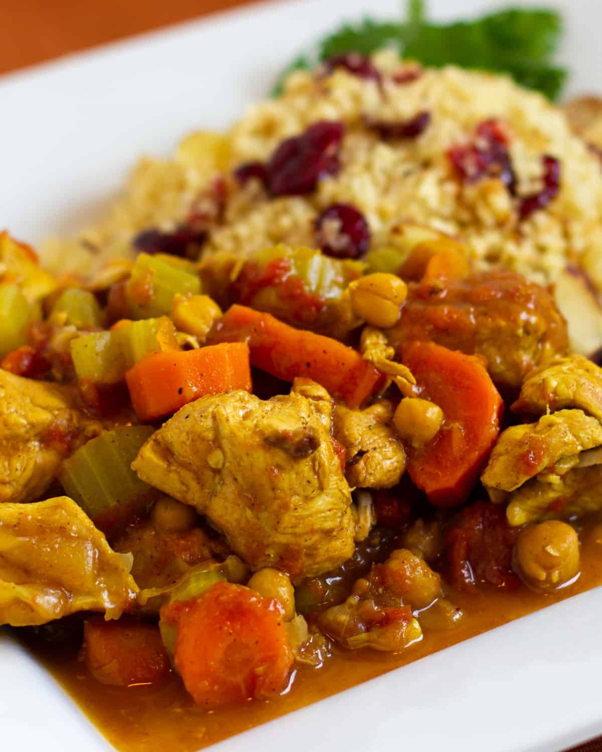 A plate of chicken tagine and couscous.