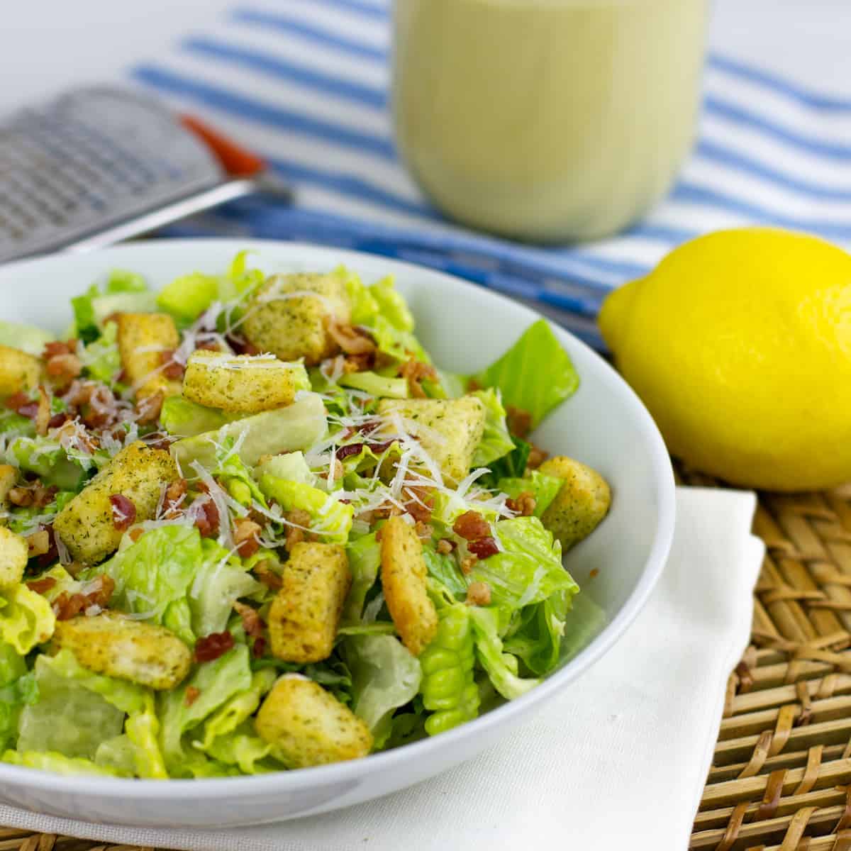 A fresh salad with bacon and croutons.