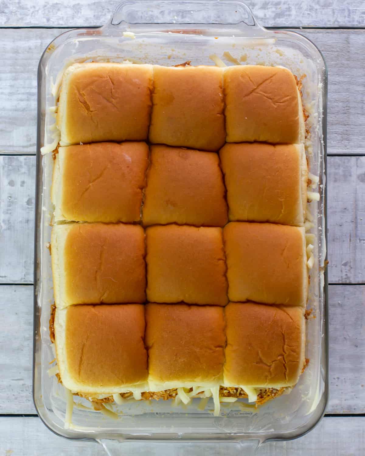 A tray of chicken sliders ready to go in the oven.