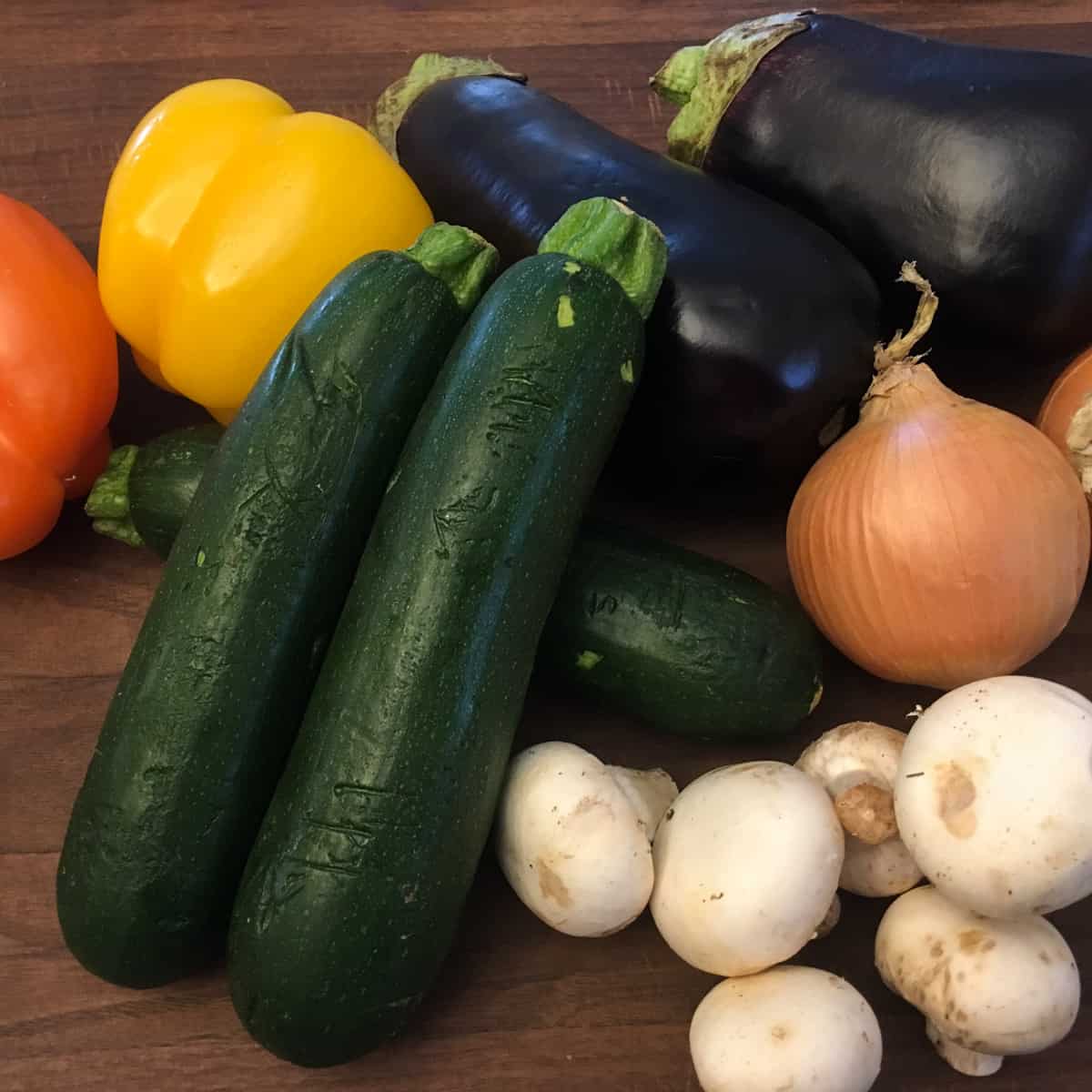 Vegetables piled together on a cutting board.