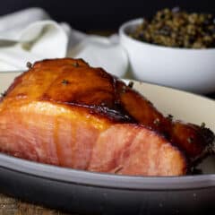 Baked ham in a roasting dish.