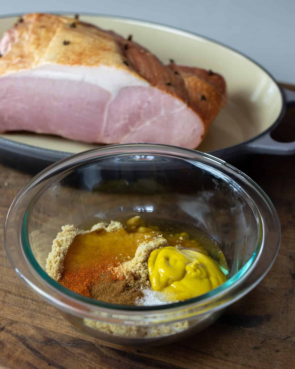 Glass bowl with ingredients to make glaze.