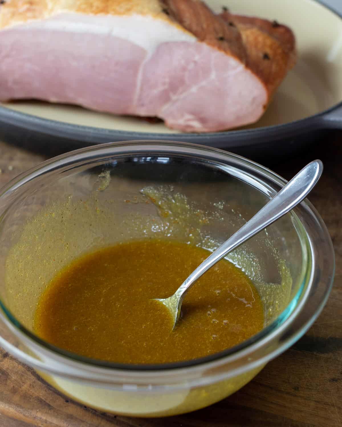 Brown sugar glaze mixed in a glass bowl.