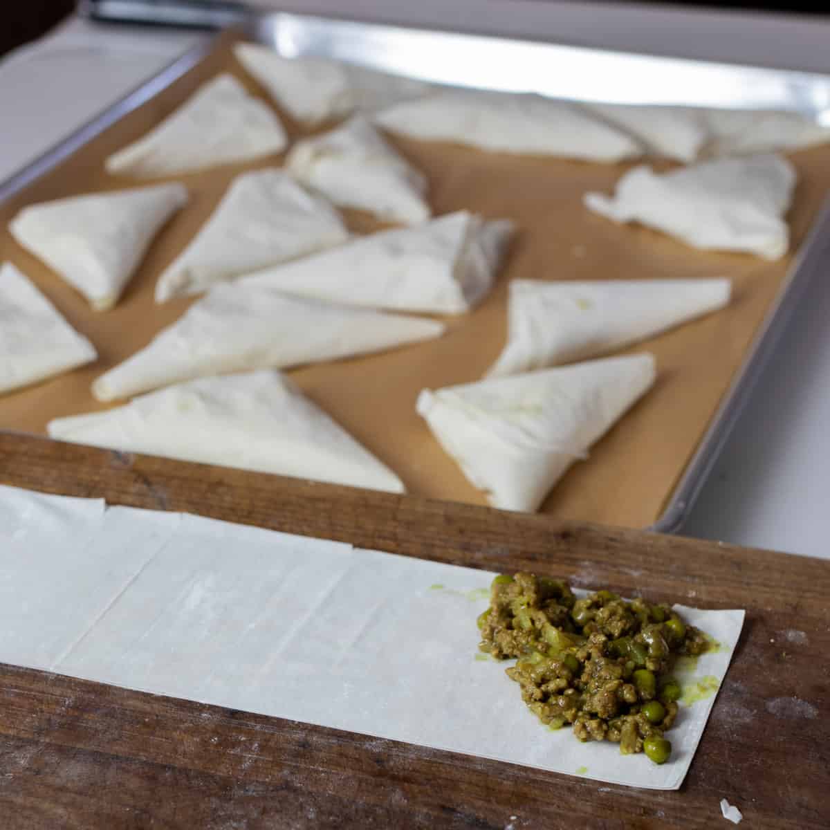 Phyllo paper with some stuffing spooned on a section.