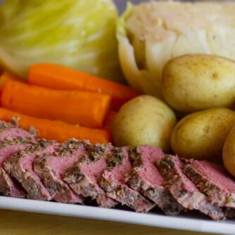 Boiled dinner on a white platter.