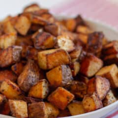 Tex mex potatoes that are in a white bowl.