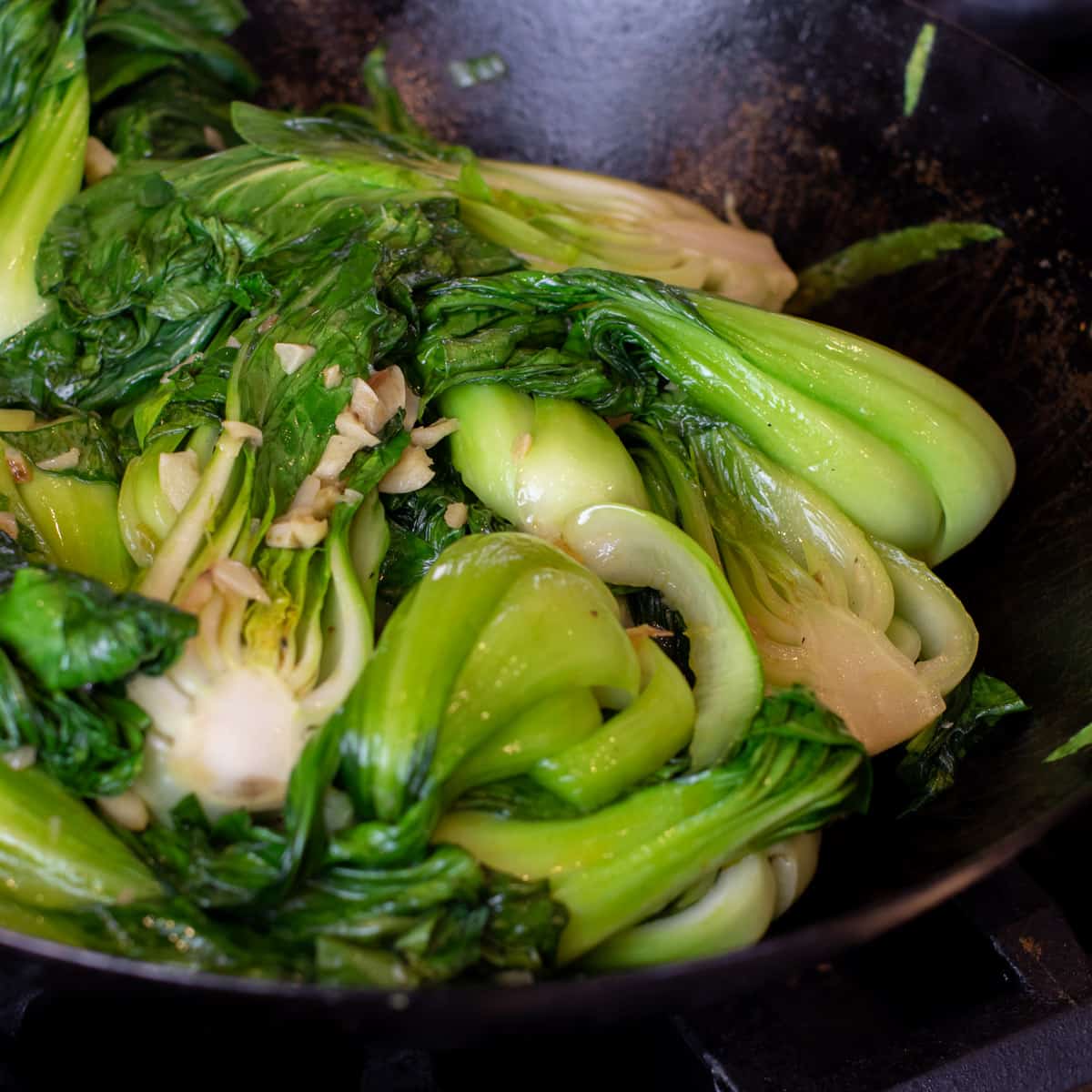 Stir fry wok with bok choy and garlic