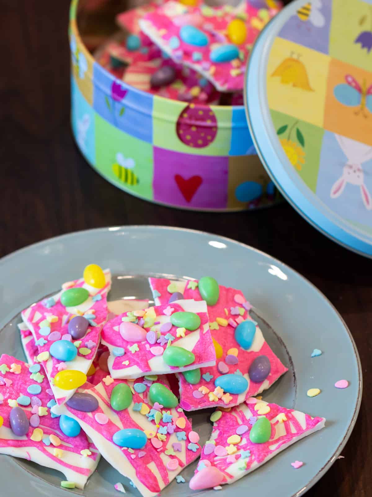 Pink candy melts with sprinkles and jelly beans.