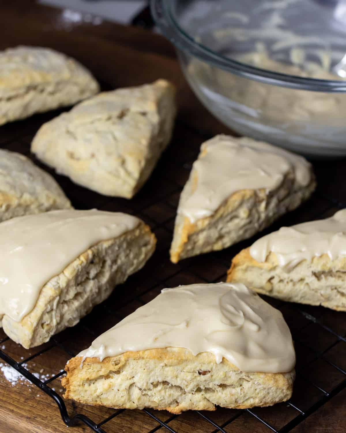 Frosted scones on a cooling rack.