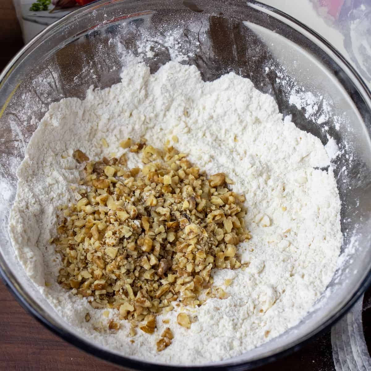 Chopped walnuts in the mixing bowl with the other dry ingredients.