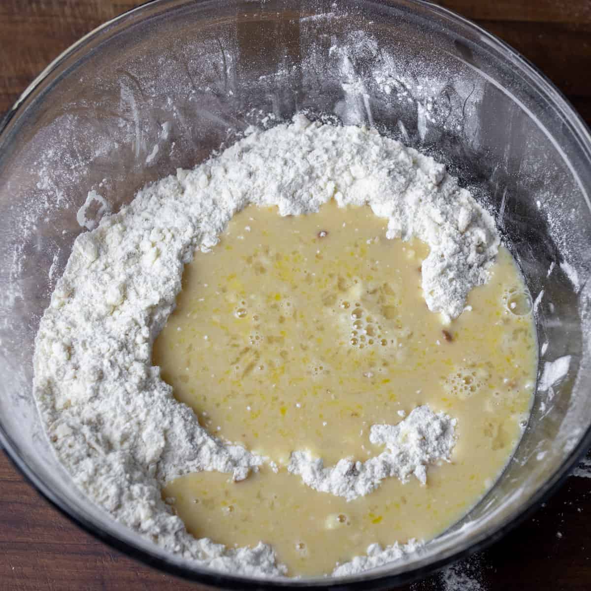 Wet ingredients poured into mixing bowl with the dry ingredients.