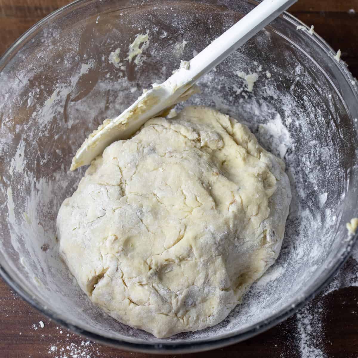 Scone dough mixed in a glass bowl.