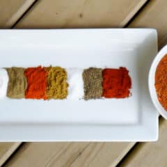 A bowl of mixed spices and a plate with them divided.
