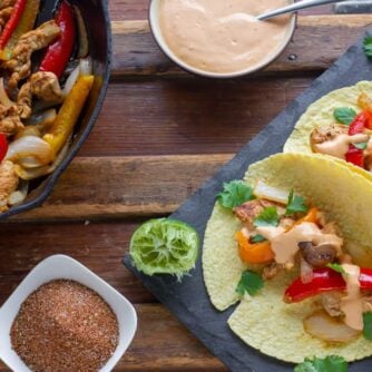 Overhead picture of assembled fajitas and a cast iron skillet.