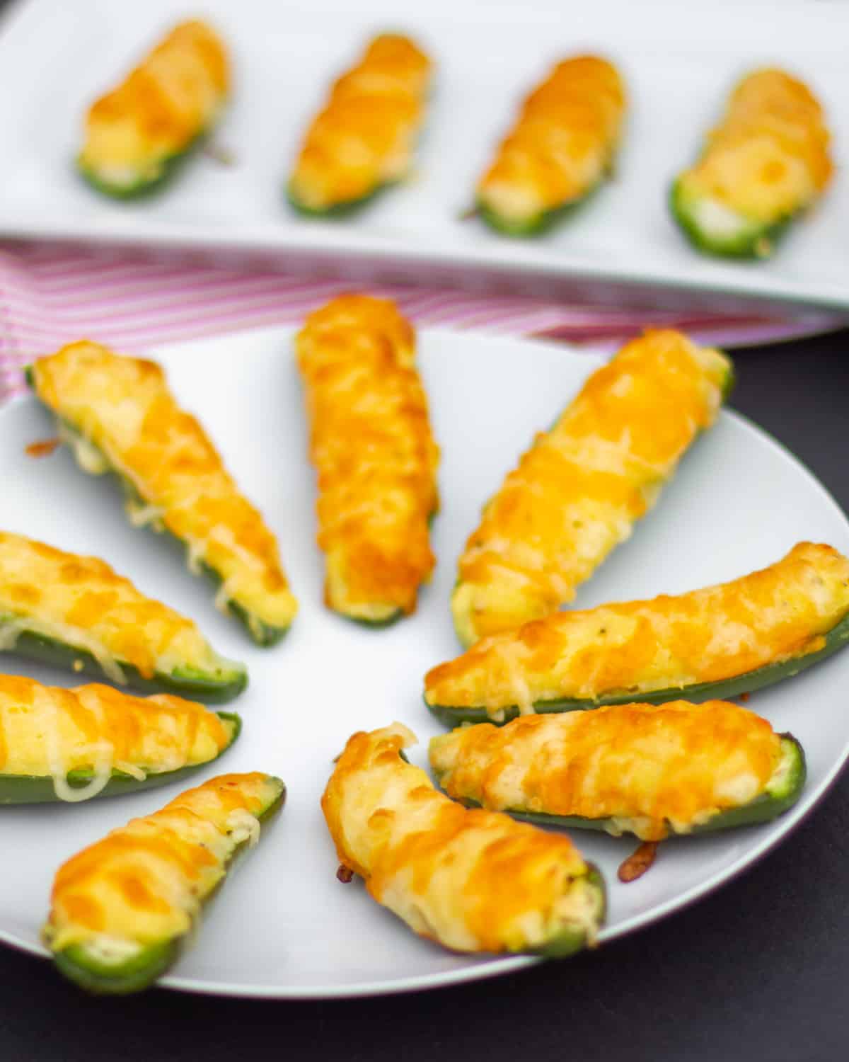 Cornbread and cheese on a jalapeno half.