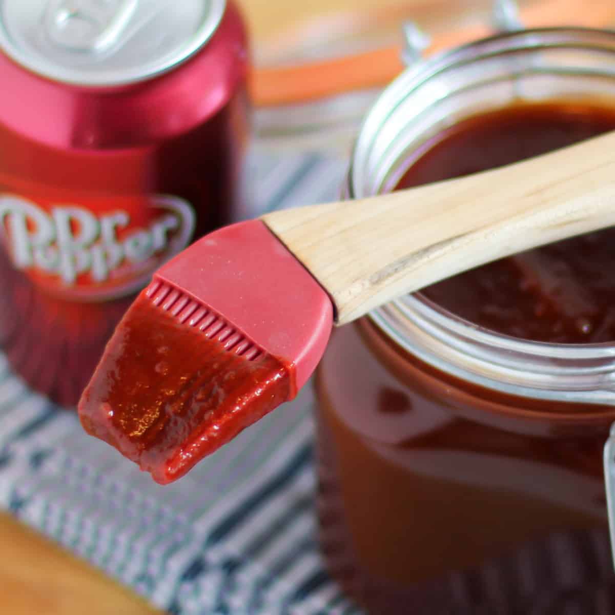 Close up picture of BBQ sauce on a basting brush.