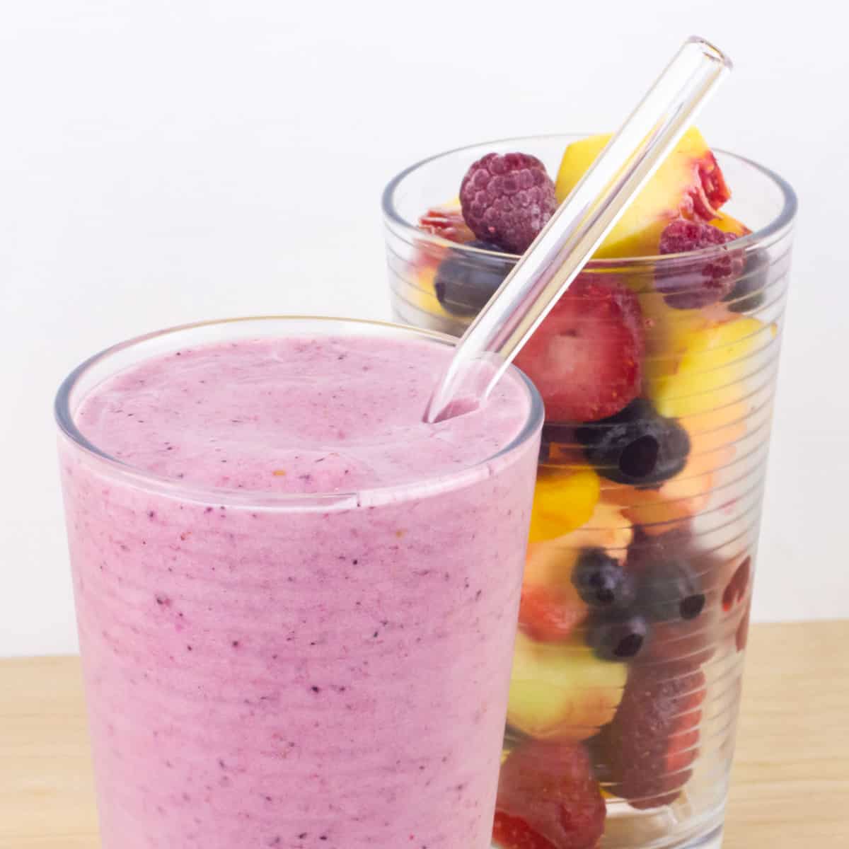 Close up picture of a fruit smoothie in a glass.