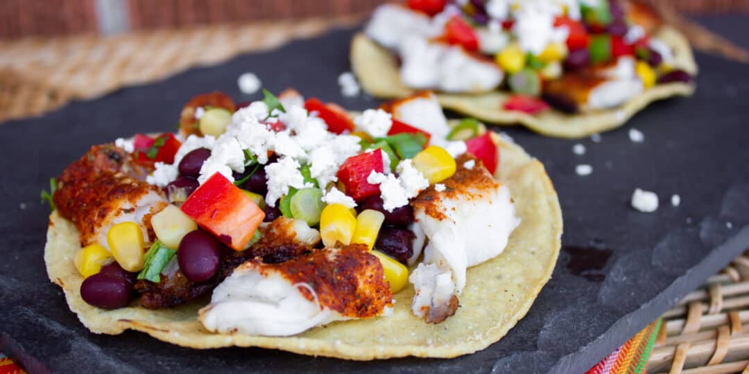 Catfish tostada on a serving slate.