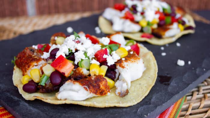 Catfish tostada on a serving slate.