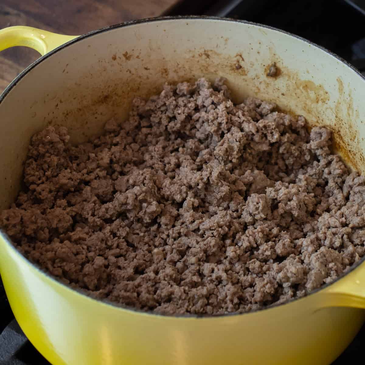 Cooked ground beef in pot.