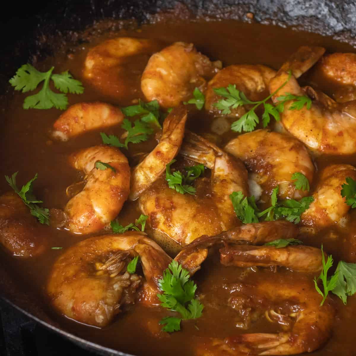 Close up of Singapore chili shrimp with fresh cilantro on top as a garnish.