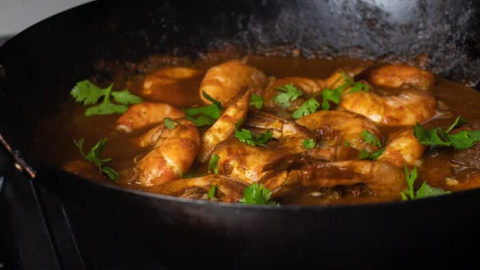 Cooked shrimp in a wok.