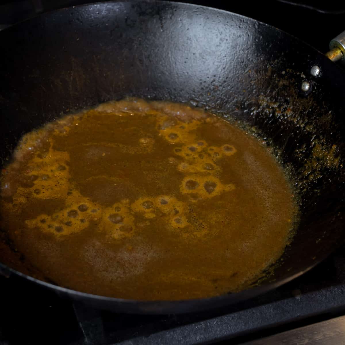 Chili paste simmering in a skillet