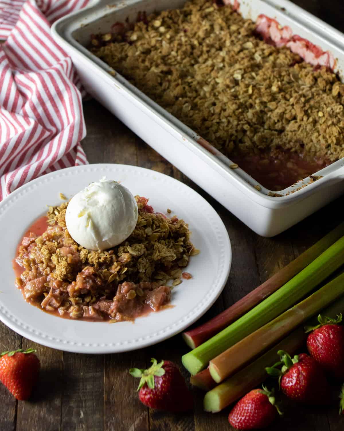 Overhead picture of a small plate with a serving of strawberry rhubarb crumble.