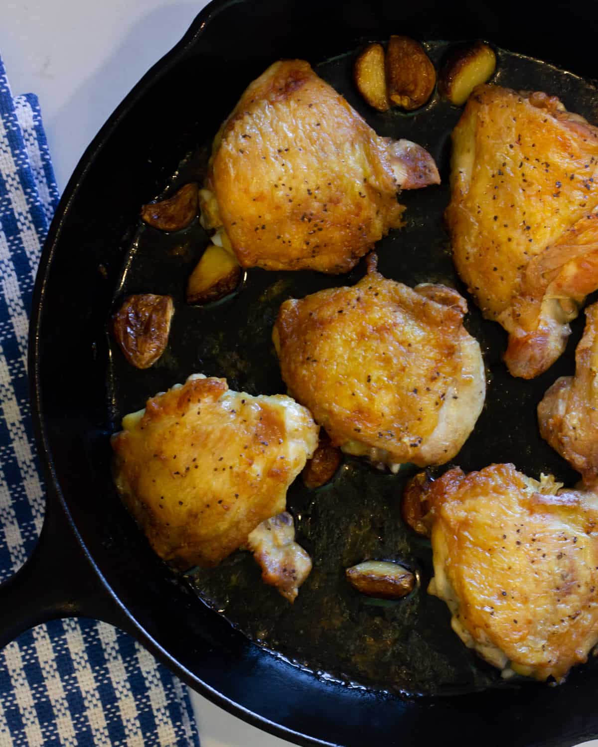 Cooked chicken in a skillet.