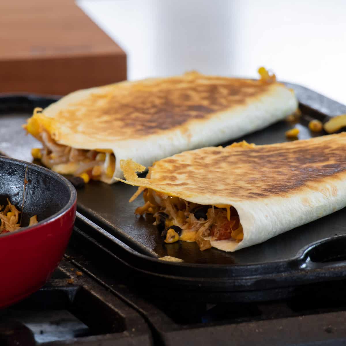 Cooked quesadilla on a griddle.