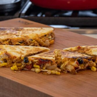 Mexican food on a cutting board.