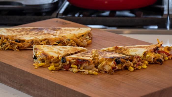 Mexican food on a cutting board.