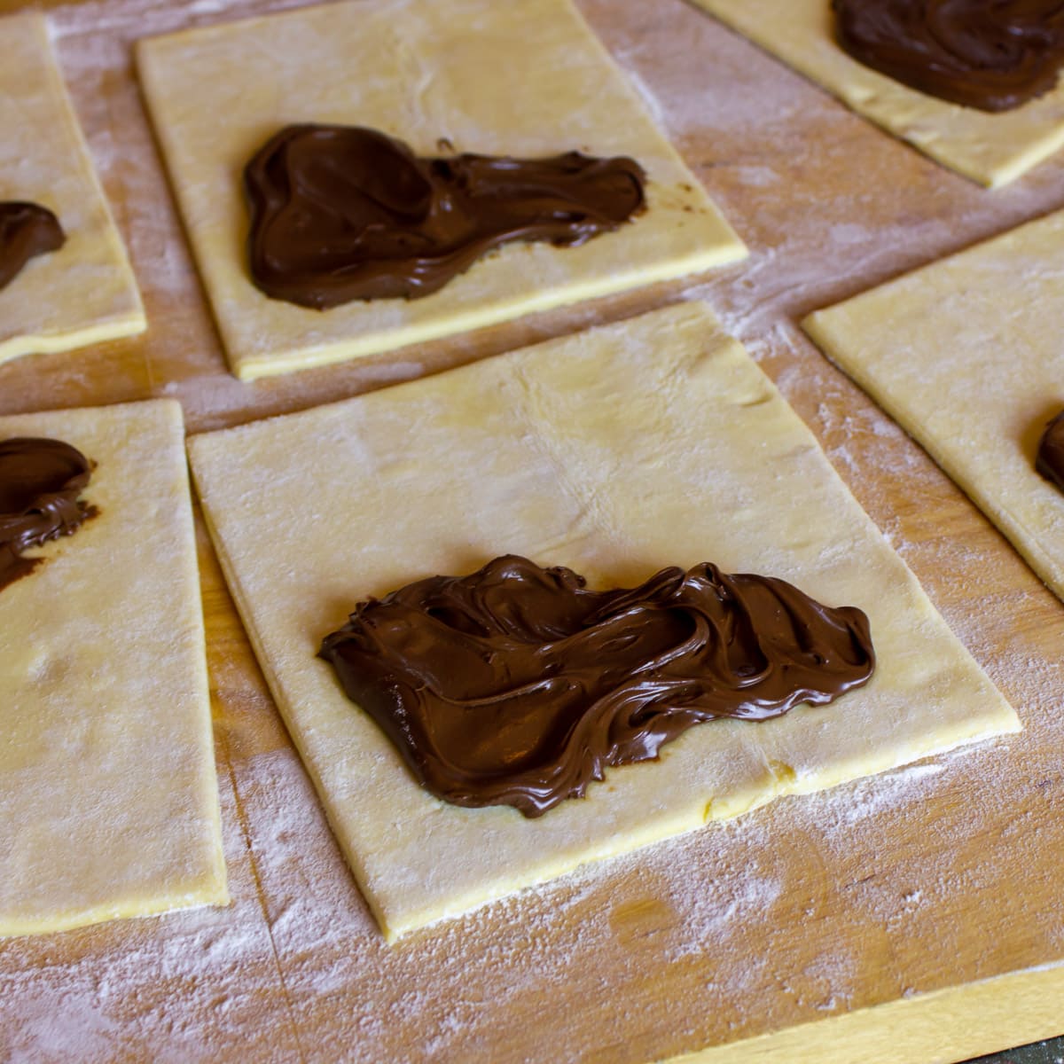 Raw puff pastry with chocolate hazelnut spread.